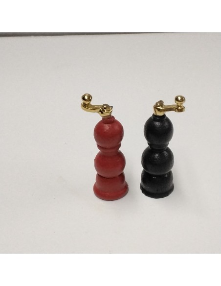 molinillo de pimienta rojo y marrón