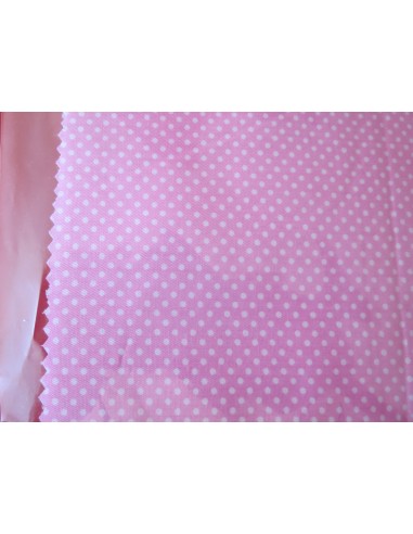 Trozo de tela rosa con lunares blancos